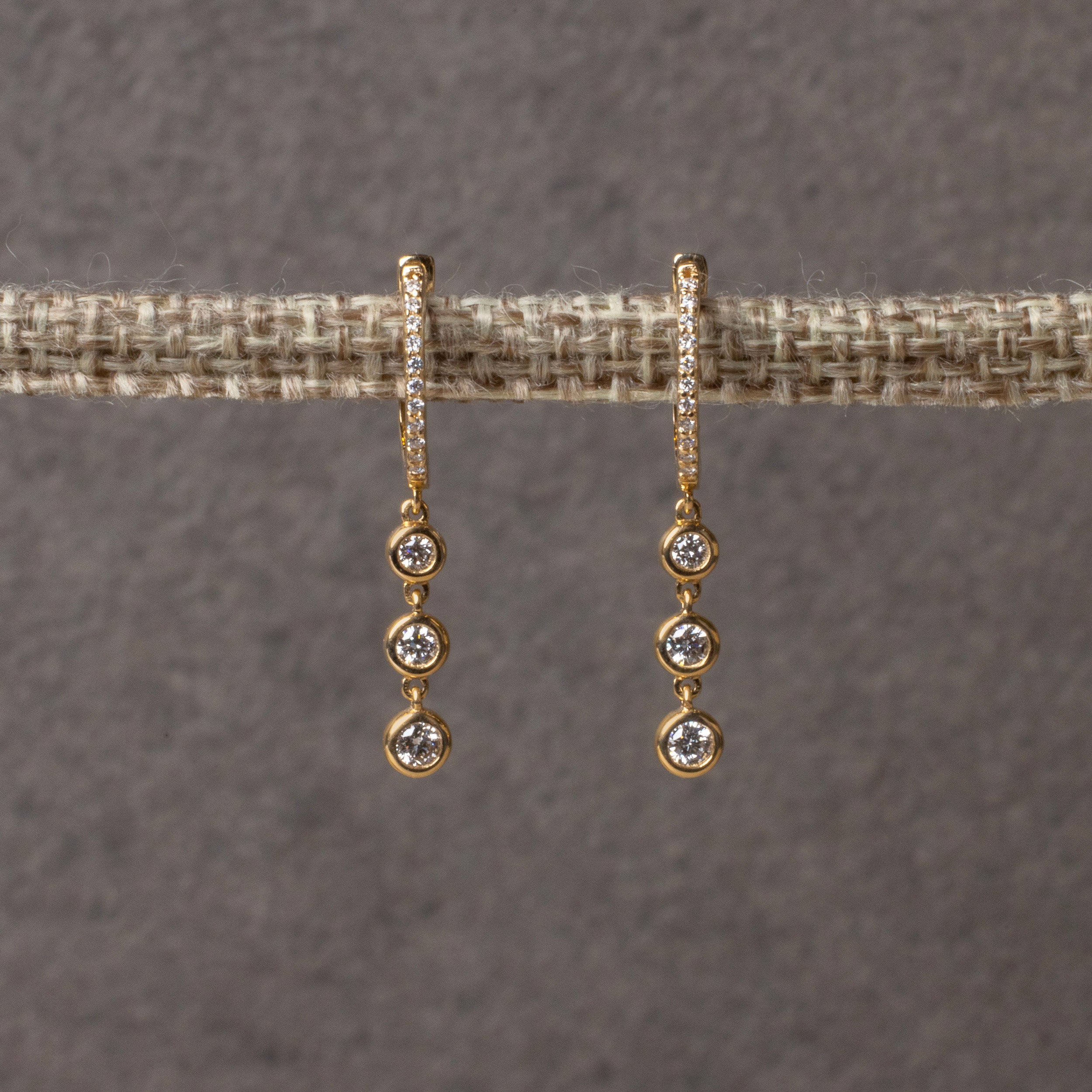 Mirta Tummino <br> Diamond Huggie With 3 Drop Bezel Earring